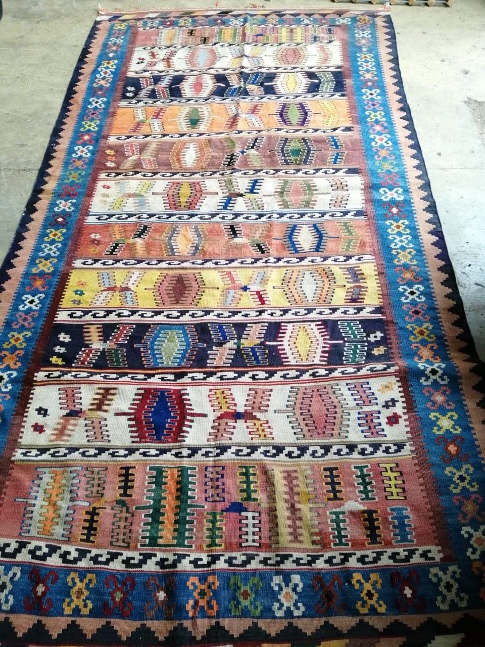 An early 20th century polychrome Kelim carpet, 280 x 140cm